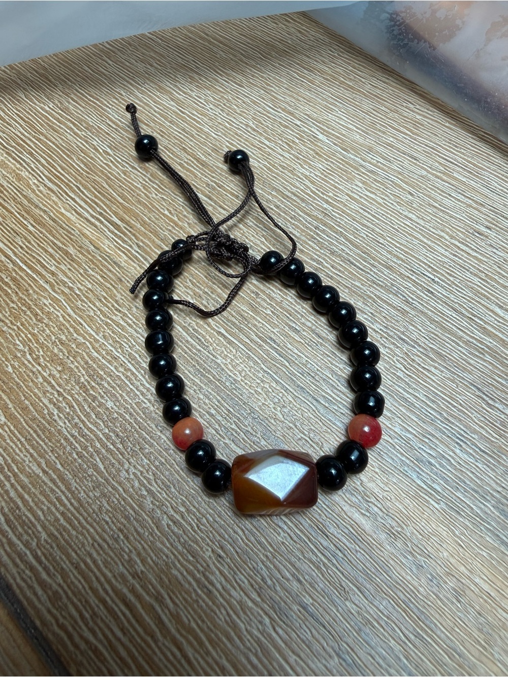 Handcrafted Black Beaded Bracelet with Amber Accent